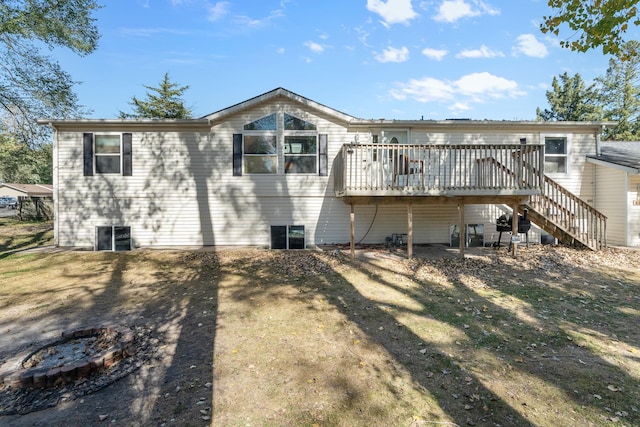 back of house featuring a deck