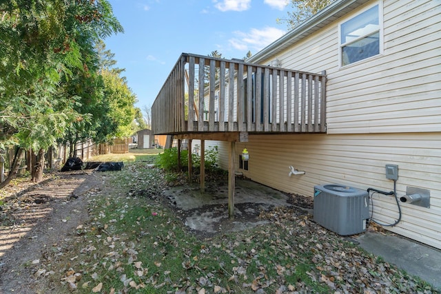 view of home's exterior featuring central AC unit and a deck