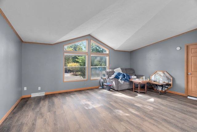 unfurnished room with hardwood / wood-style floors and vaulted ceiling