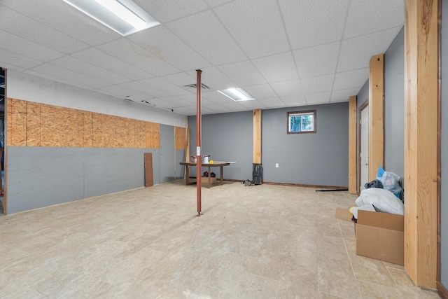 basement featuring a paneled ceiling