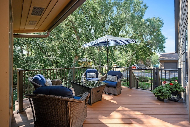 wooden deck featuring an outdoor living space