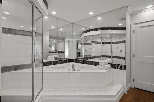 bathroom with separate shower and tub and hardwood / wood-style floors