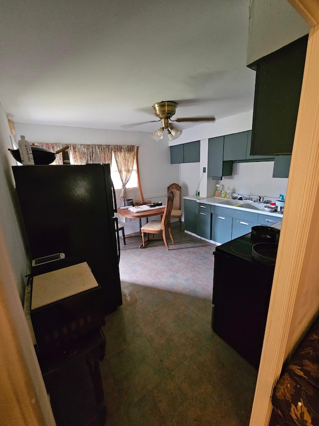 kitchen with ceiling fan, dark carpet, and black / electric stove