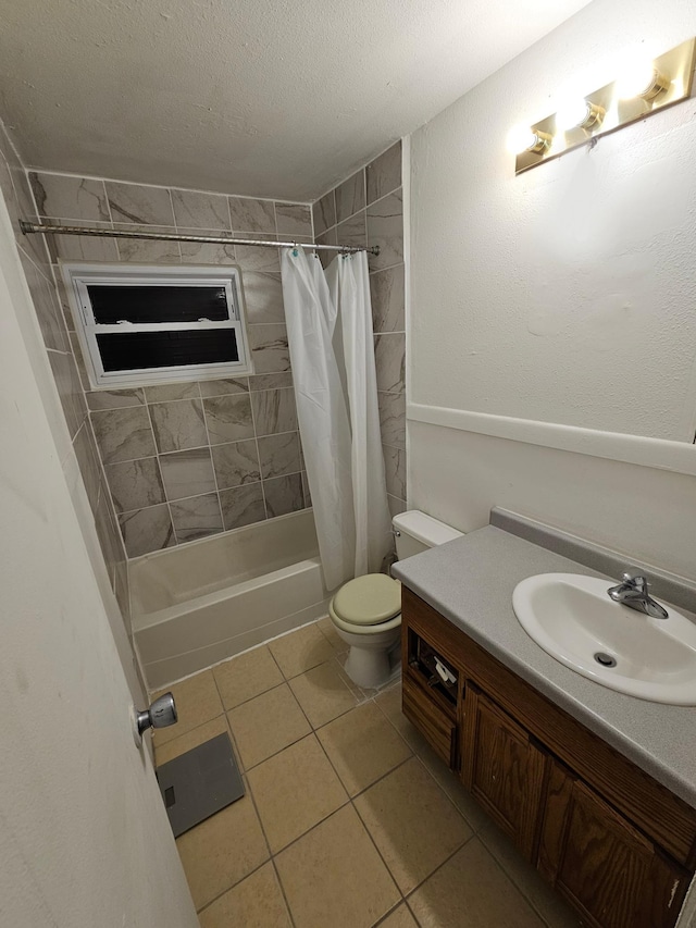 full bathroom with vanity, tile patterned floors, toilet, a textured ceiling, and shower / tub combo