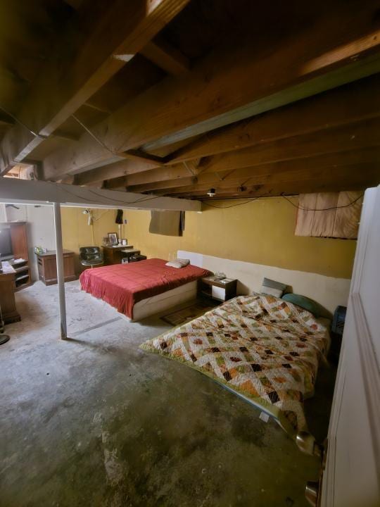 bedroom featuring concrete flooring and billiards