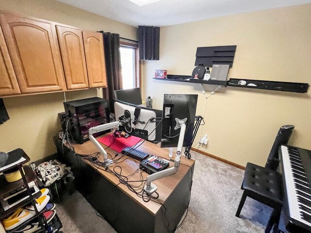 carpeted office space featuring baseboards
