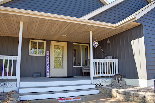 doorway to property featuring covered porch