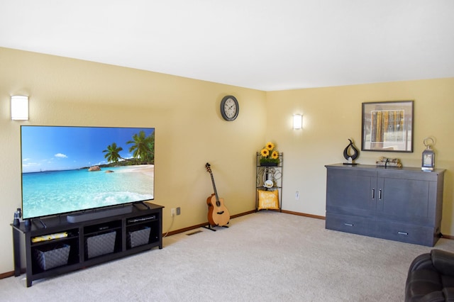 living area with light carpet and baseboards