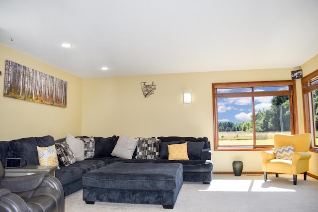 carpeted living room with baseboards and recessed lighting