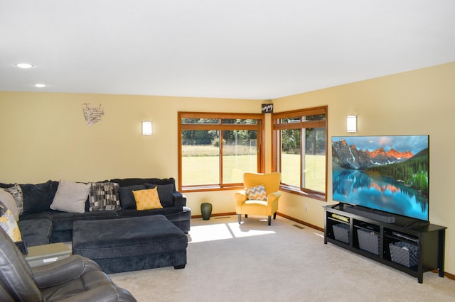 living area featuring carpet, baseboards, and recessed lighting