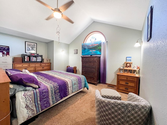 bedroom featuring ceiling fan, carpet, and lofted ceiling