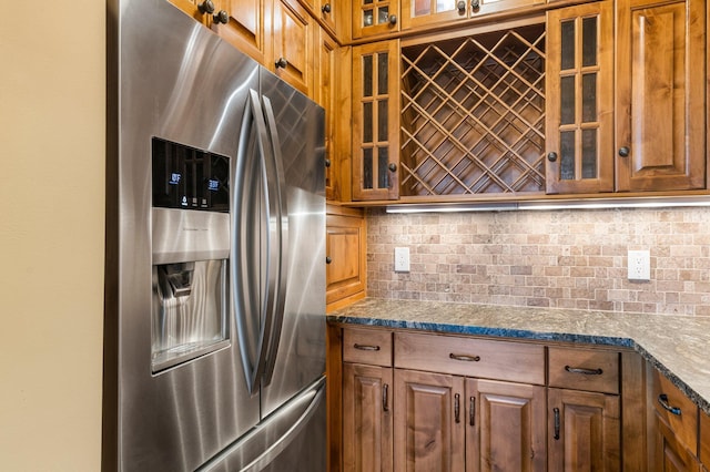 1201 Yale Pl Unit 2303, Minneapolis, MN 55403 - kitchen with stainless steel refrigerator with ice dispenser, glass insert cabinets, and brown cabinets