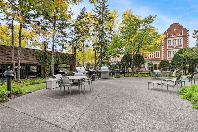 1201 Yale Pl Unit 2303, Minneapolis, MN 55403 - view of property's community featuring outdoor dining space and a patio