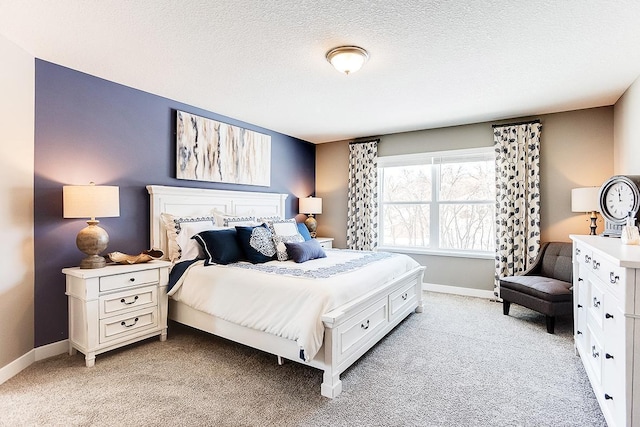 carpeted bedroom with a textured ceiling