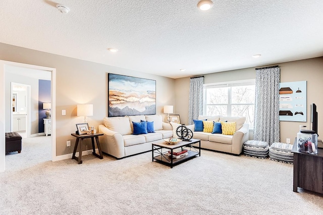 living room with carpet floors and a textured ceiling