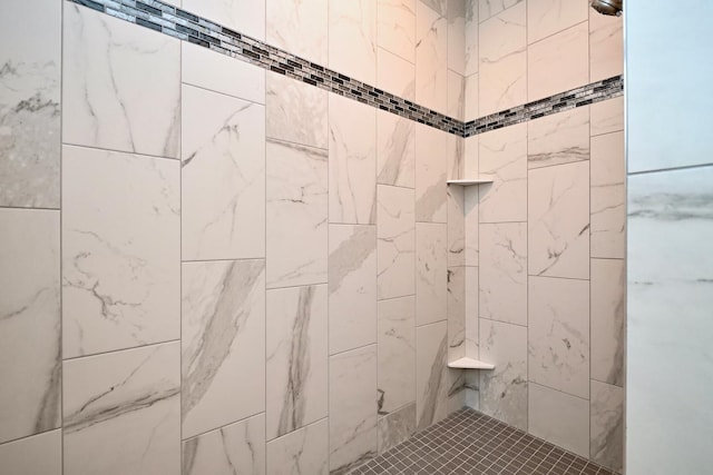 bathroom featuring a tile shower