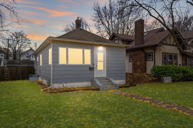 view of front of house with a lawn