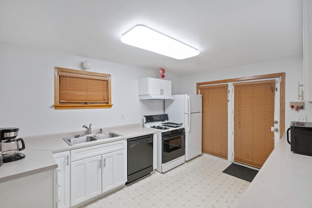 kitchen featuring sink, white cabinets, and white appliances