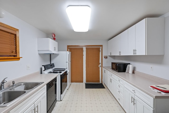 kitchen with white cabinetry, sink, and black appliances