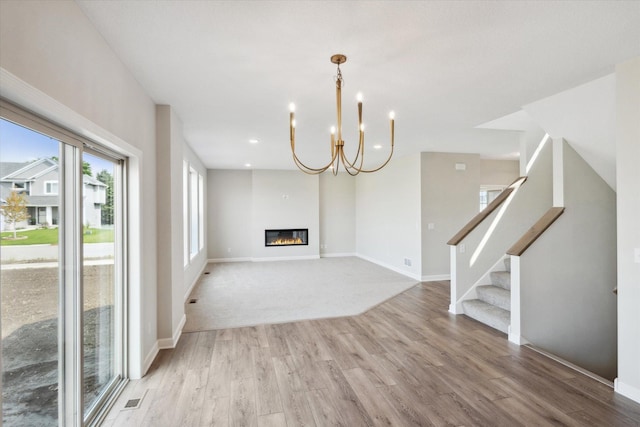 unfurnished living room with light wood-type flooring