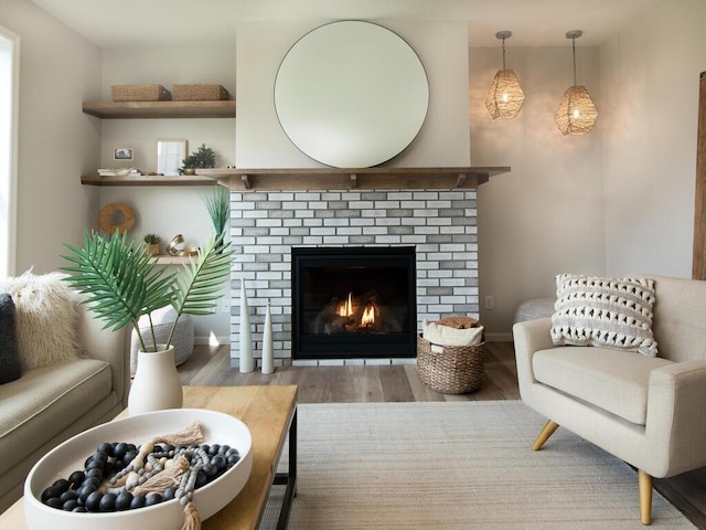 living room featuring light hardwood / wood-style flooring and a fireplace