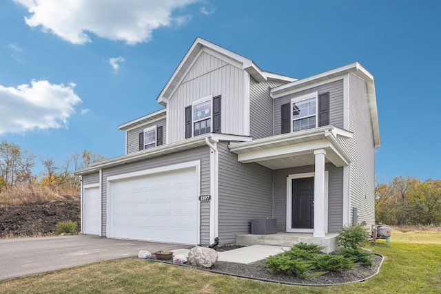 view of property featuring a garage and a front yard