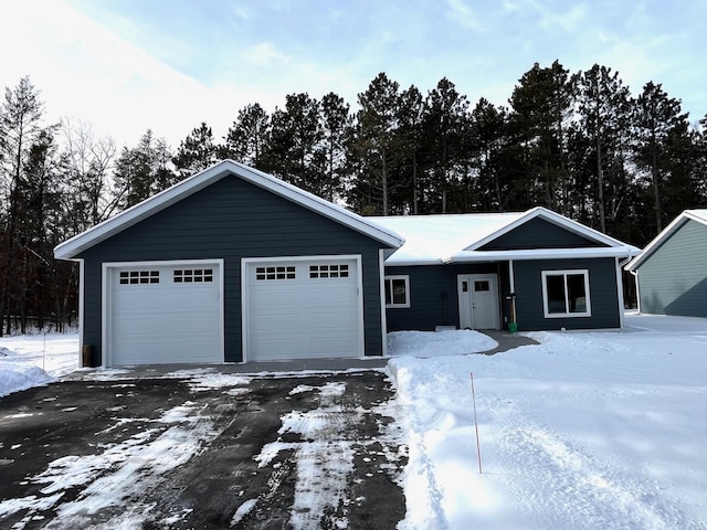 ranch-style home with a garage