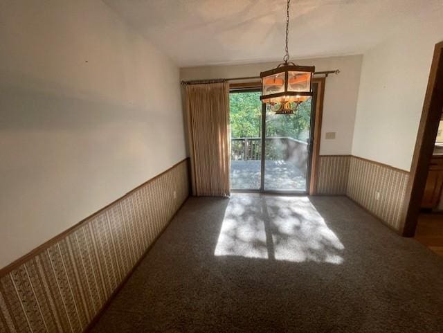 unfurnished dining area with an inviting chandelier