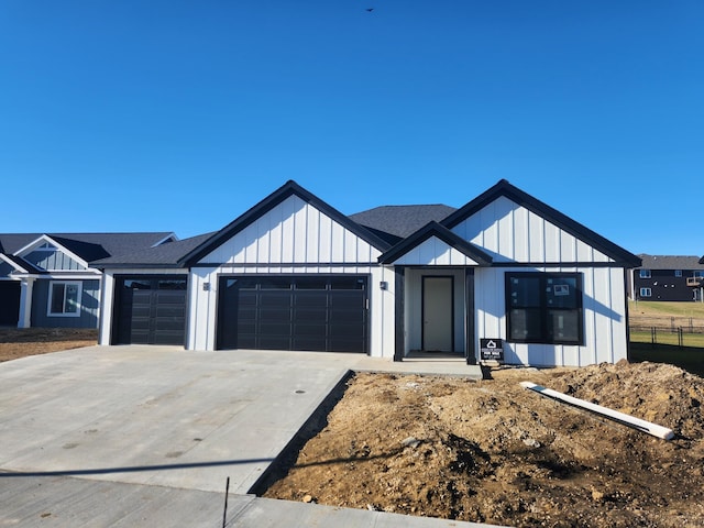 modern farmhouse style home with a garage