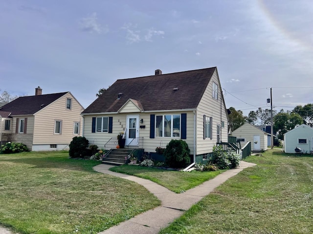 bungalow-style house with a front lawn