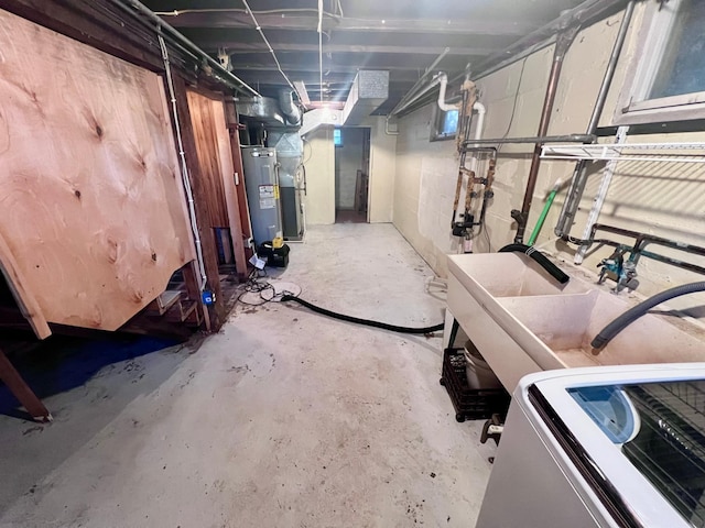 basement with electric water heater and sink