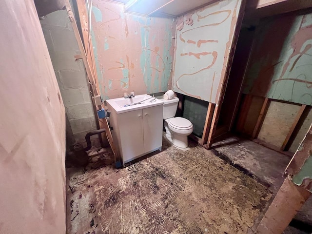 bathroom featuring toilet and vanity