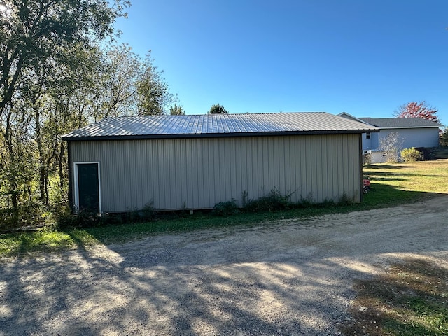 view of side of property with an outbuilding