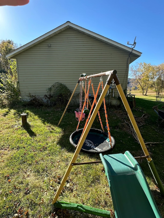 view of jungle gym with a yard