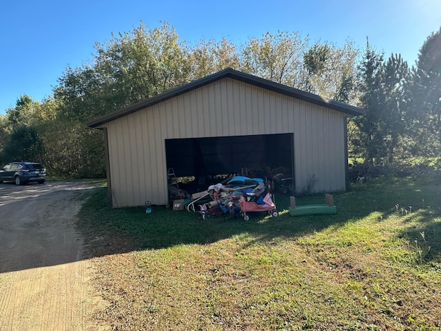 garage featuring a yard