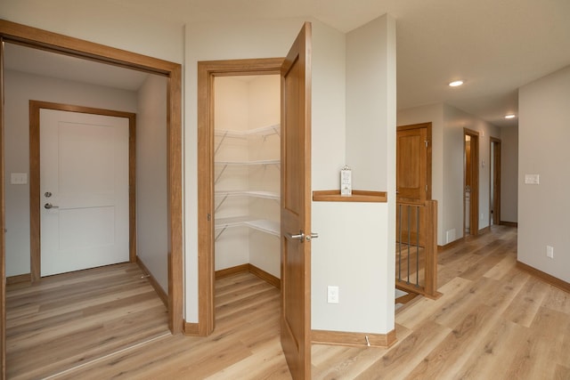 1309 18th St NE, Austin, MN 55912 - hallway featuring baseboards, recessed lighting, an upstairs landing, and light wood-style flooring