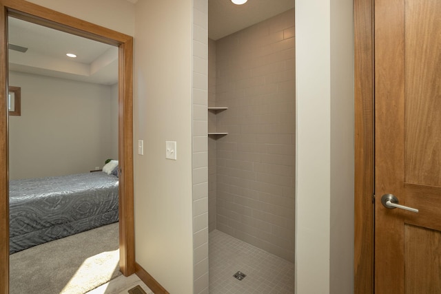 bathroom with a tile shower