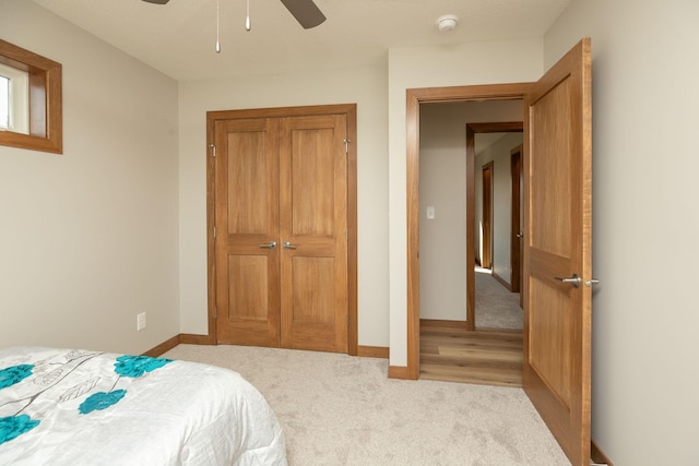 carpeted bedroom featuring ceiling fan