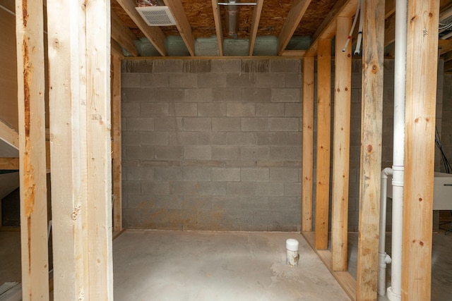 1309 18th St NE, Austin, MN 55912 - unfinished basement featuring concrete block wall and visible vents