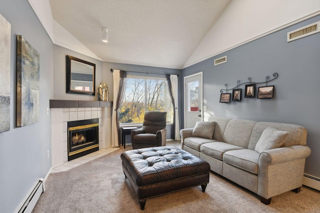 living room featuring vaulted ceiling, a baseboard radiator, a tile fireplace, and light colored carpet