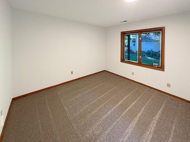 empty room featuring carpet flooring