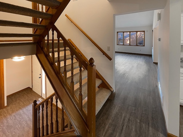 stairs with hardwood / wood-style flooring