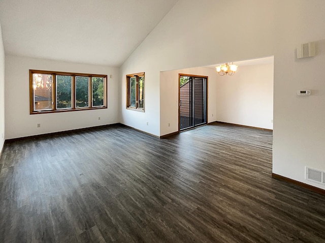 unfurnished living room featuring an inviting chandelier, dark hardwood / wood-style floors, and high vaulted ceiling