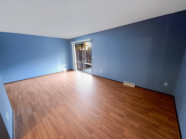 empty room with light wood-type flooring