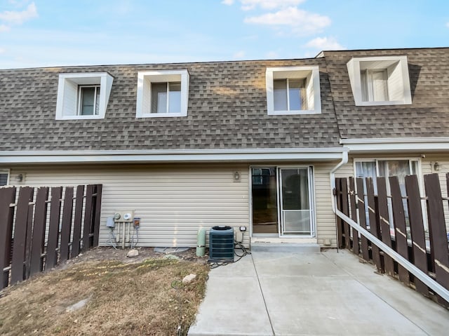 rear view of house featuring central AC and a patio area