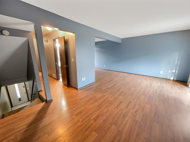 unfurnished living room with light hardwood / wood-style floors