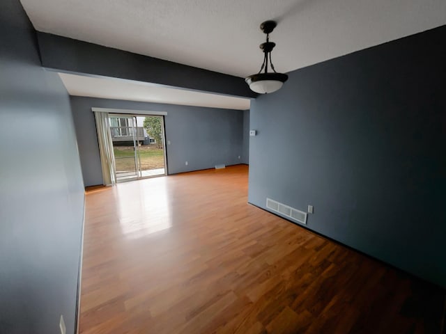 spare room with light hardwood / wood-style floors