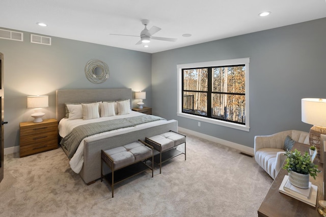 bedroom featuring ceiling fan and light colored carpet