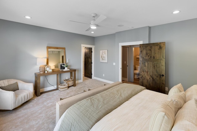 carpeted bedroom with ceiling fan and connected bathroom