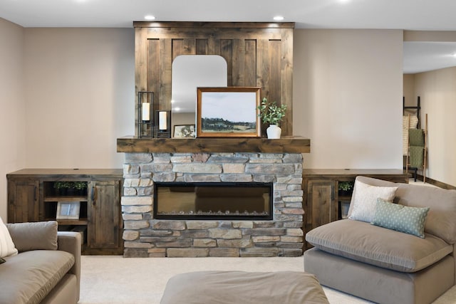 carpeted living room featuring a fireplace